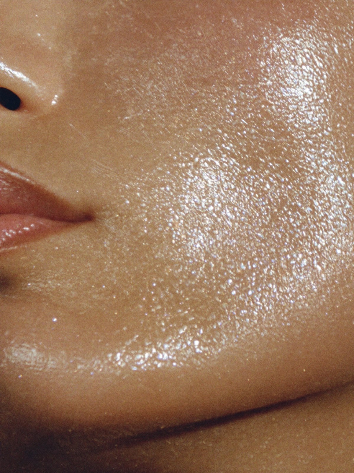 Luminous glass skin in soft warm light